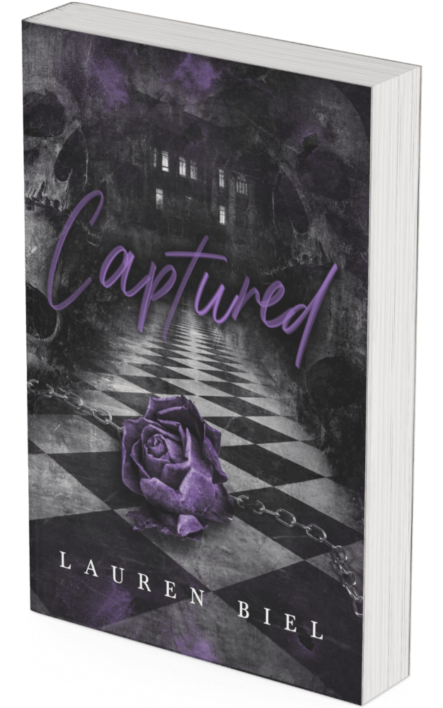 A 3d book mockup with a cover depicting a chained purple rose and and skulls in the corners